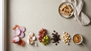 Grapes, raisins, onions, garlic, macadamia nuts, and sugar-free peanut butter to keep away from dogs.